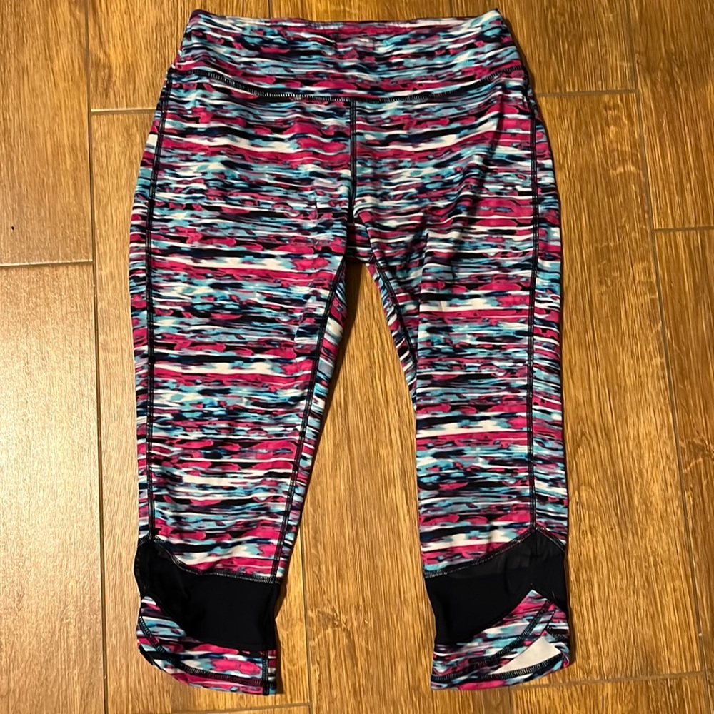 Workout tight . Mid/calf.  Muti colored . Size medium.
